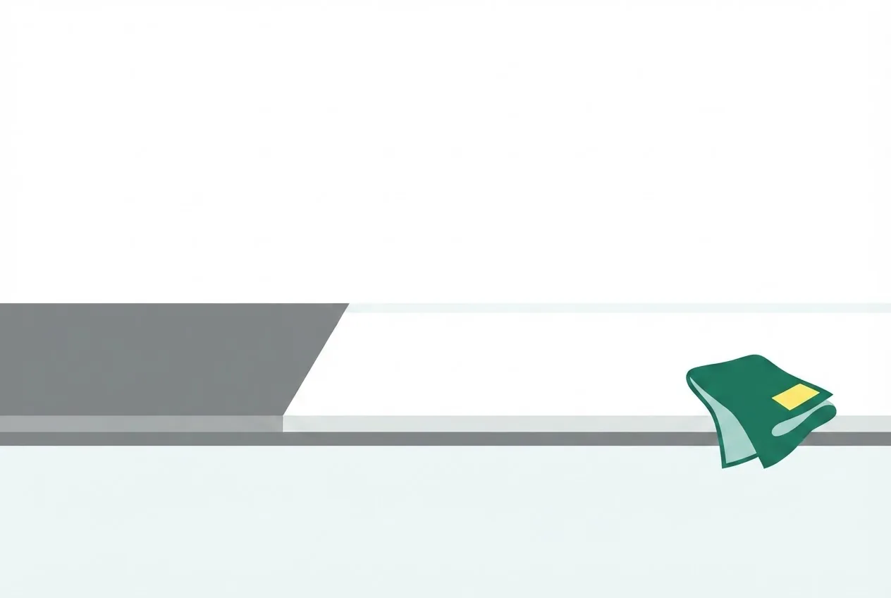 Flat-vector illustration of a kitchen counter two thirds wiped, with a green #1E7A4D cloth folded at the edge